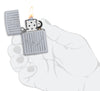 Zippo Feuerzeug Gravur mit dekorativem Semannsanker und Streifen Online Only geöffnet mit Flamme in stilisierter Hand