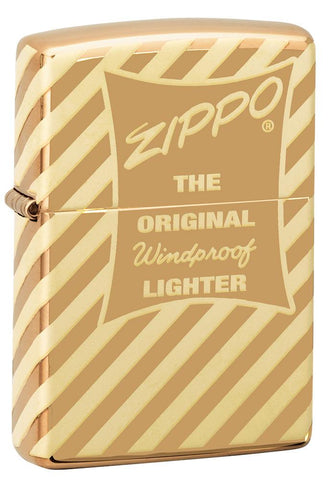 Vue de face 3/4 briquet Zippo laiton haute brillance logo Zippo rétro et rayure transversale gravés
