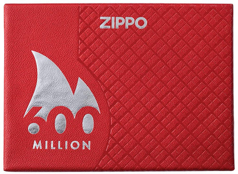 Briquet Zippo 600 Million vue de face emballage fermé luxueux en rouge avec le logo 600 Million entouré d'une flamme blanche