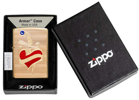 Briquet Zippo Armor en laiton cœur rouge avec poignard et pierre Swarovski, dans une boîte ouverte