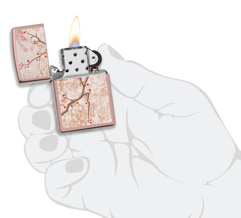 Zippo Feuerzeug Osterzweig mit Kirschblüten Rose Gold Online Only geöffnet mit Flamme in stilisierter Hand