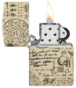 Briquet Zippo 540° vue de face ouvert et allumé avec illustration en couleur et fait de métal qui montre des motifs alchimiques qui couvrent toute la surface avec des crânes, des bougies et des écritures mystérieuses.