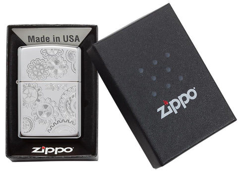 Briquet Zippo chromé avec engrenages, dans une boîte ouverte