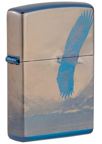 Vue de face 3/4 briquet Zippo bleu haute brillance panorama de montagne avec aigle en vol