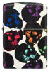 Briquet Zippo 540° Vue de face du briquet Skulls Design avec des têtes de mort multicolores qui brillent dans la nuit.